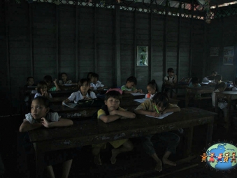 Khmer children study at the Vietnamese Catholic School in Tonle Spa (lake)